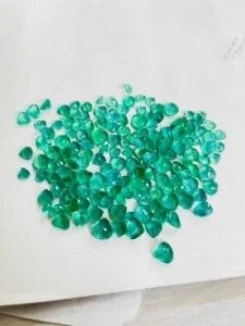 Rough uncut emerald gemstones